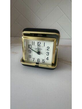Bulova B6112 Vintage travel alarm clock-gold trim in black case